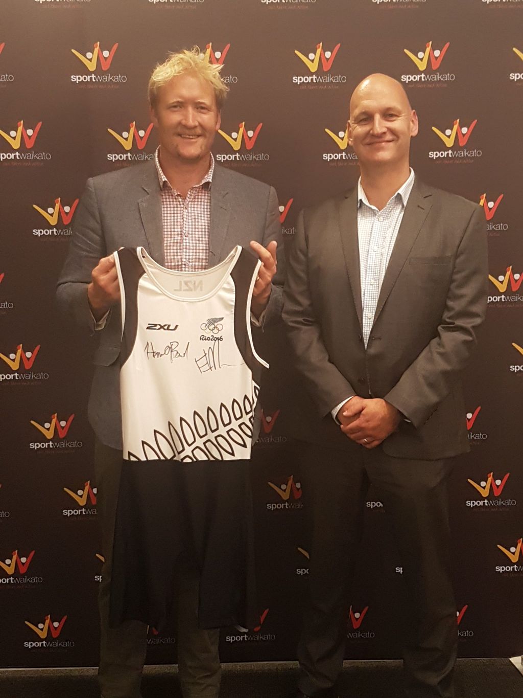 New Zealand rowing legend Eric Murray (left) and The Lines Company chief executive Sean Horgan with Murray’s 2016 Rio de Janeiro Olympics rowing suit which is being auctioned on Trade Me to raise money to buy bikes for deserving kids this Christmas.